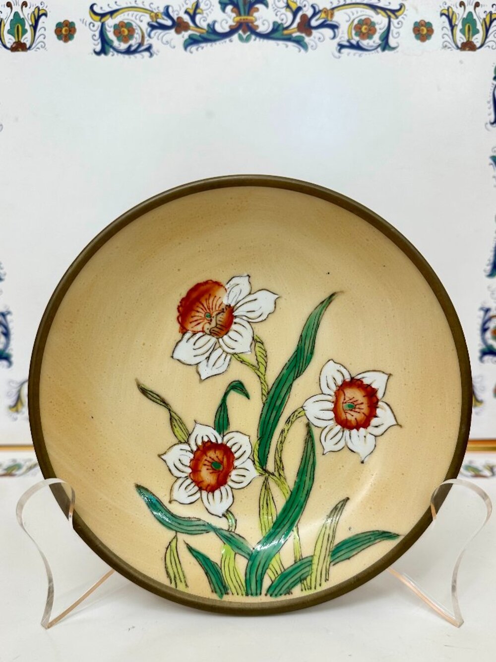 Japanese porcelain bowl featuring a brass-clad edge/bottom